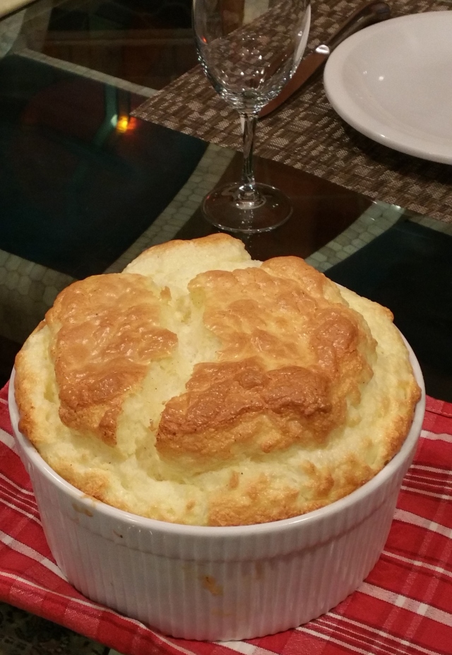 Soufflé ready for presentation. For a soufflé this height, I filled the dish to about one-and-a-half inches below the rim. You can also tie parchment paper around the outside of your dish if you want to make a taller one, then remove the paper before serving.